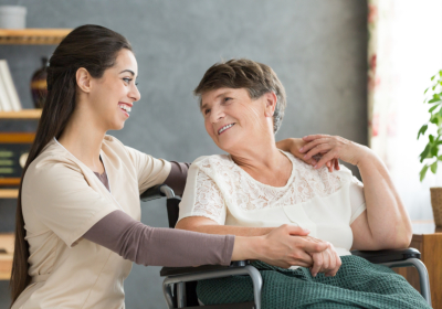 caregiver and senior laughing